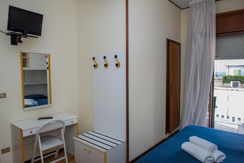 Postel nebo postele na pokoji v ubytování Hotel Malibran