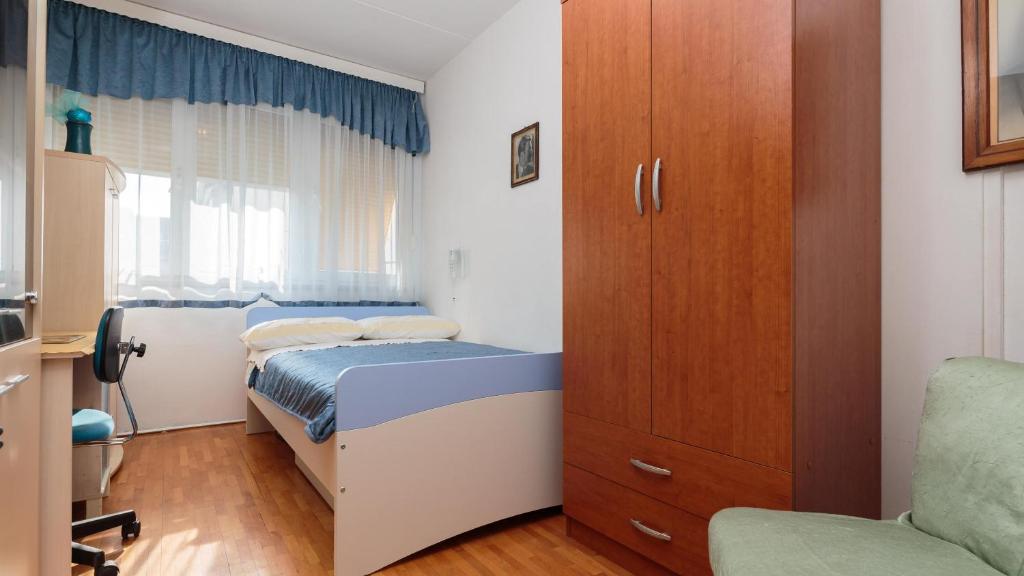Postel nebo postele na pokoji v ubytování Apartment Karolina