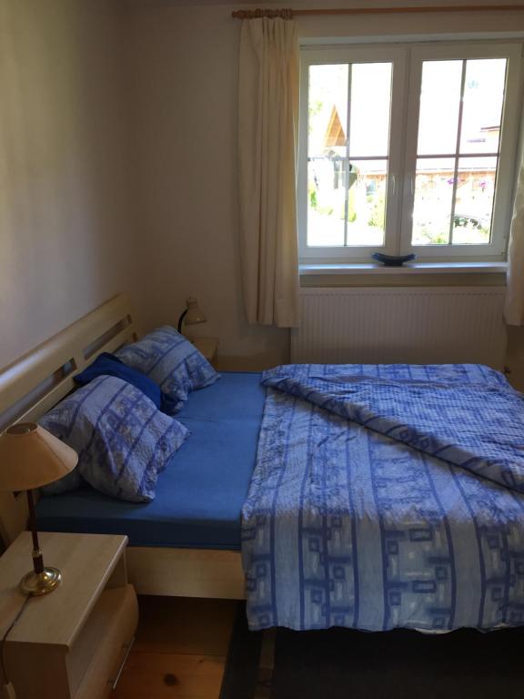Postel nebo postele na pokoji v ubytování Apartments Huty