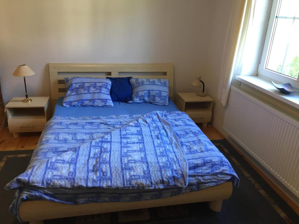Postel nebo postele na pokoji v ubytování Apartments Huty
