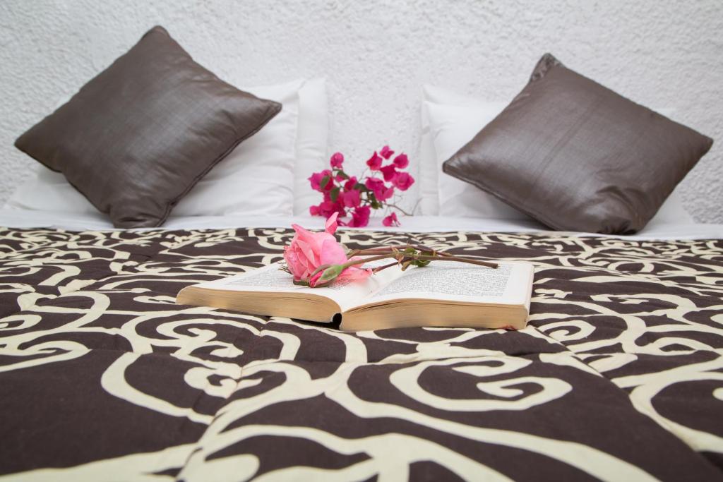 A bed or beds in a room at Pantokrator Hotel