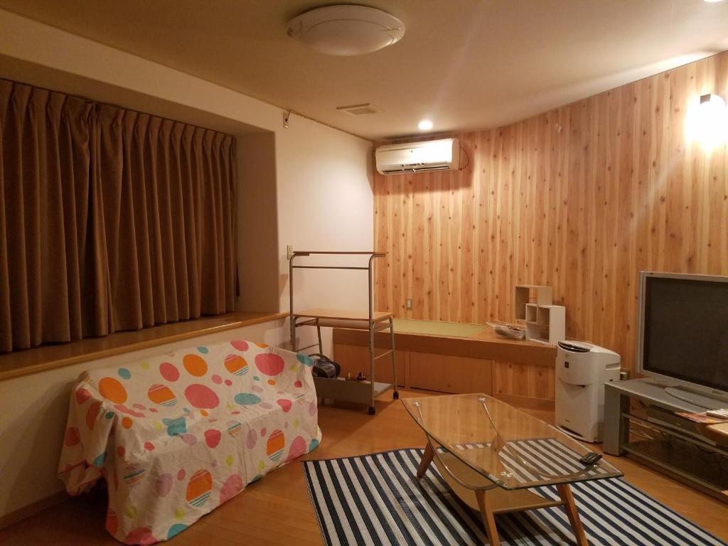TV a/nebo společenská místnost v ubytování Villa M Guesthouse
