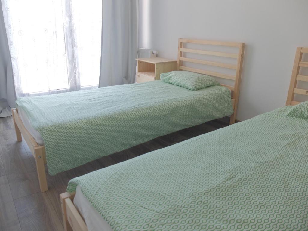 Posteľ alebo postele v izbe v ubytovaní Pixel White Apart
