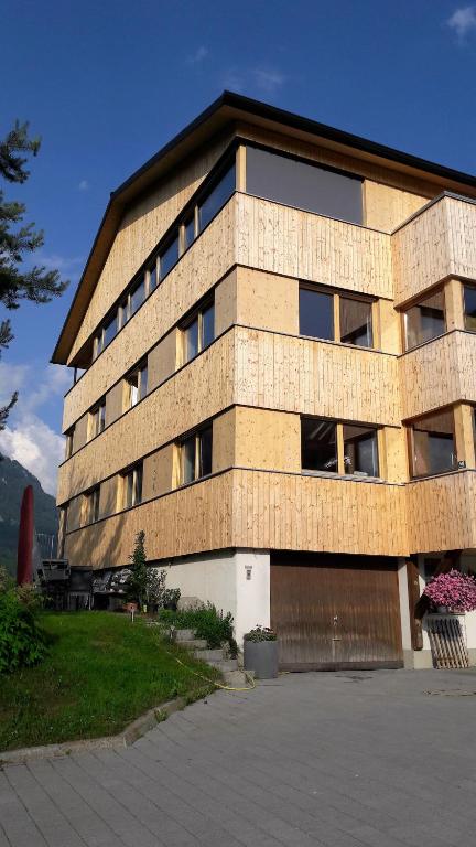 a large brick building with a lot of windows at Haus Katharina in Schnepfau