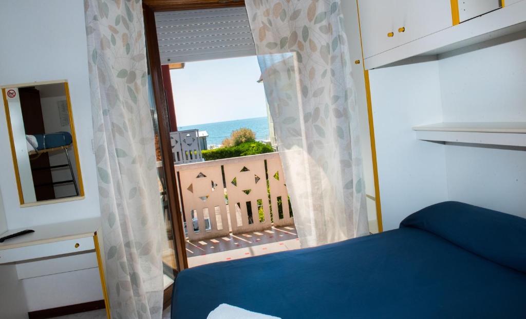 Postel nebo postele na pokoji v ubytování Hotel Malibran
