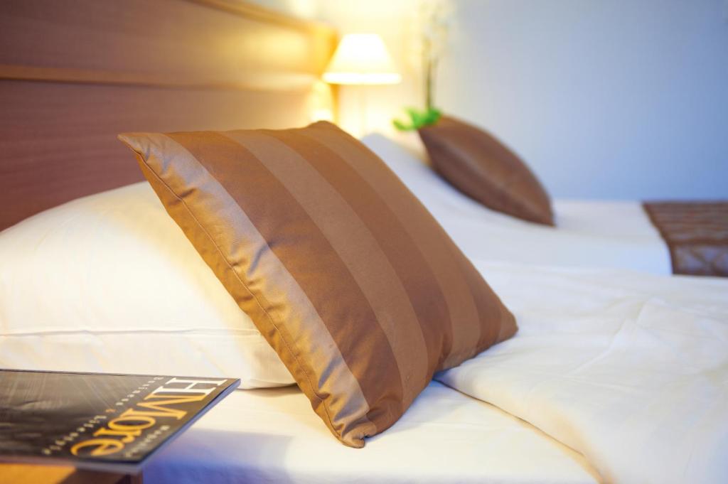 Postel nebo postele na pokoji v ubytování Bastion Hotel Leeuwarden