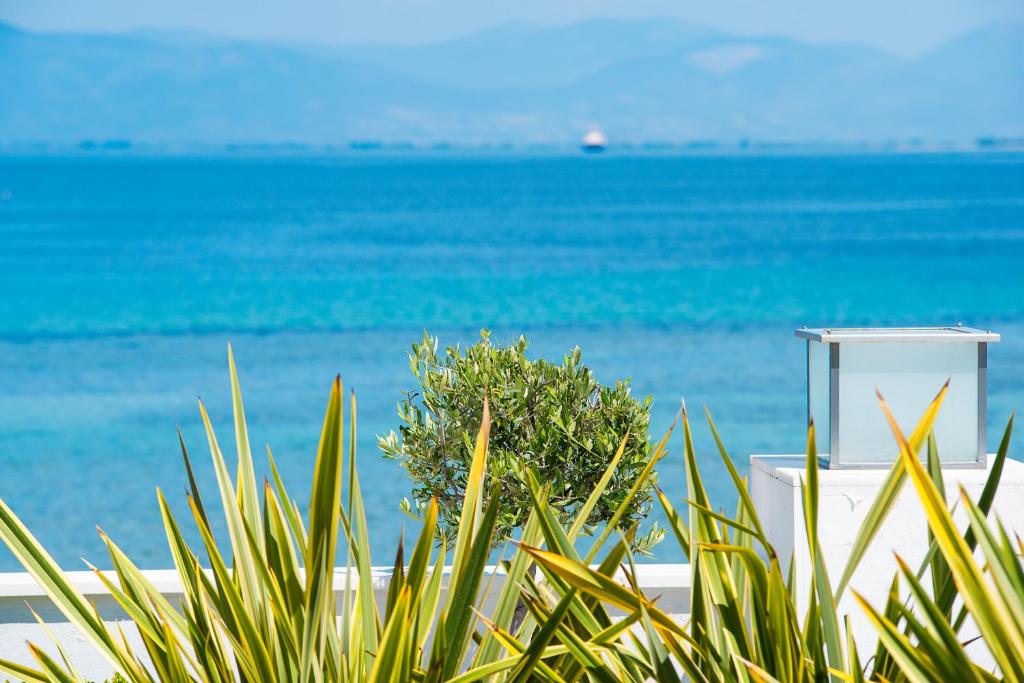 a view of the ocean from a beach at Mythodea Apartments in Limenas