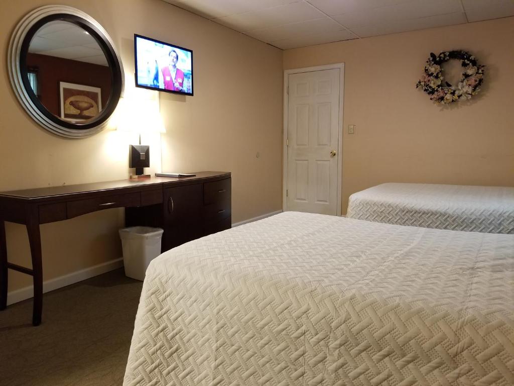 Postel nebo postele na pokoji v ubytování Lido Motel Lake George