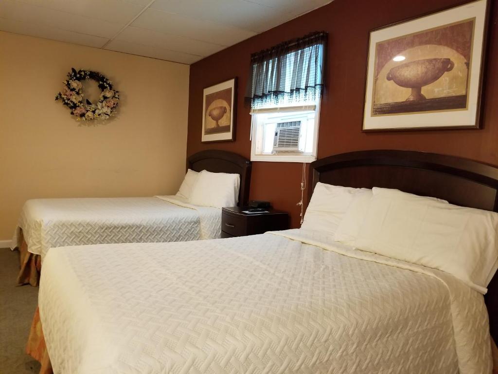 Postel nebo postele na pokoji v ubytování Lido Motel Lake George