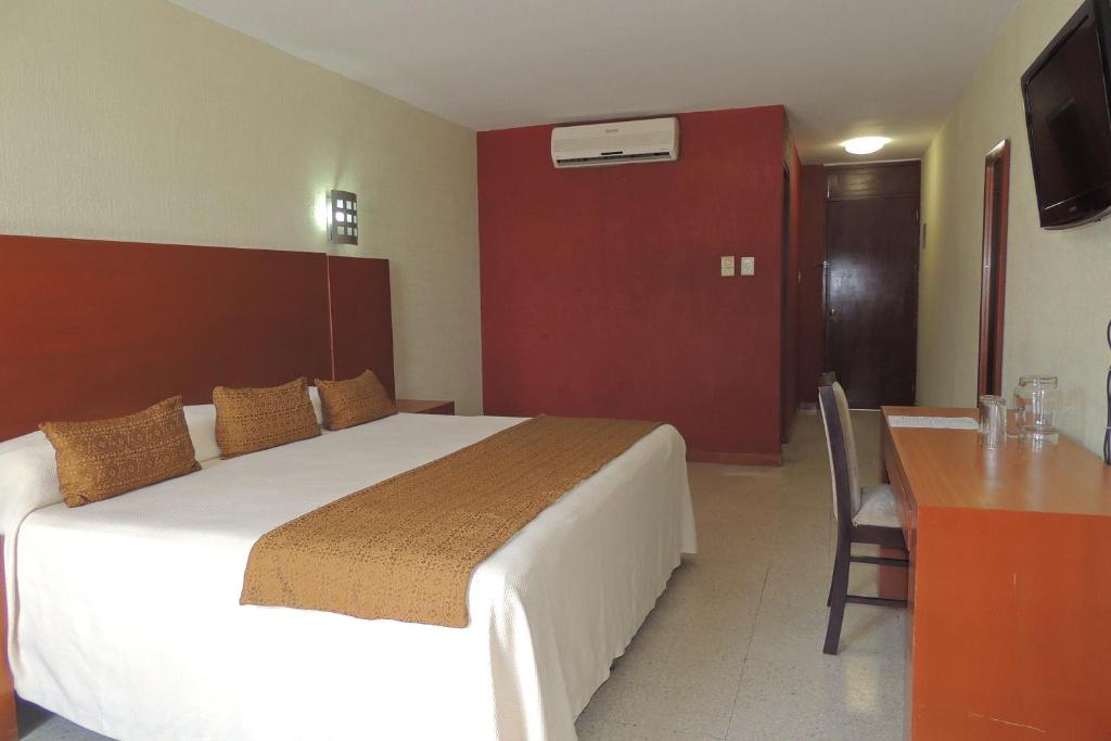 Postel nebo postele na pokoji v ubytování Hotel Central