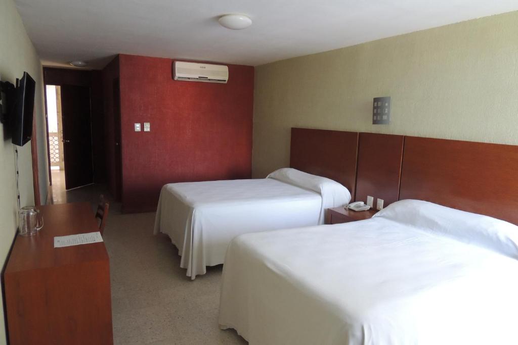 Postel nebo postele na pokoji v ubytování Hotel Central