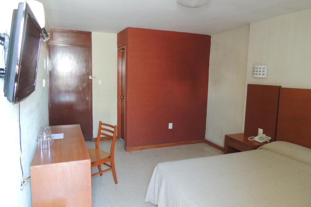 Postel nebo postele na pokoji v ubytování Hotel Central