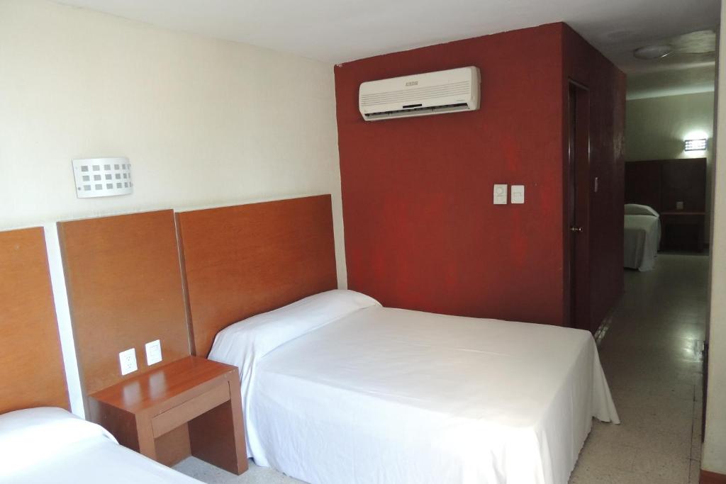 Postel nebo postele na pokoji v ubytování Hotel Central
