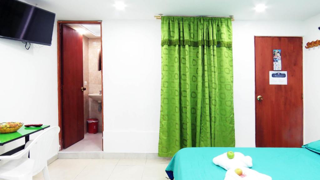 Postel nebo postele na pokoji v ubytování Hotel Bogota House