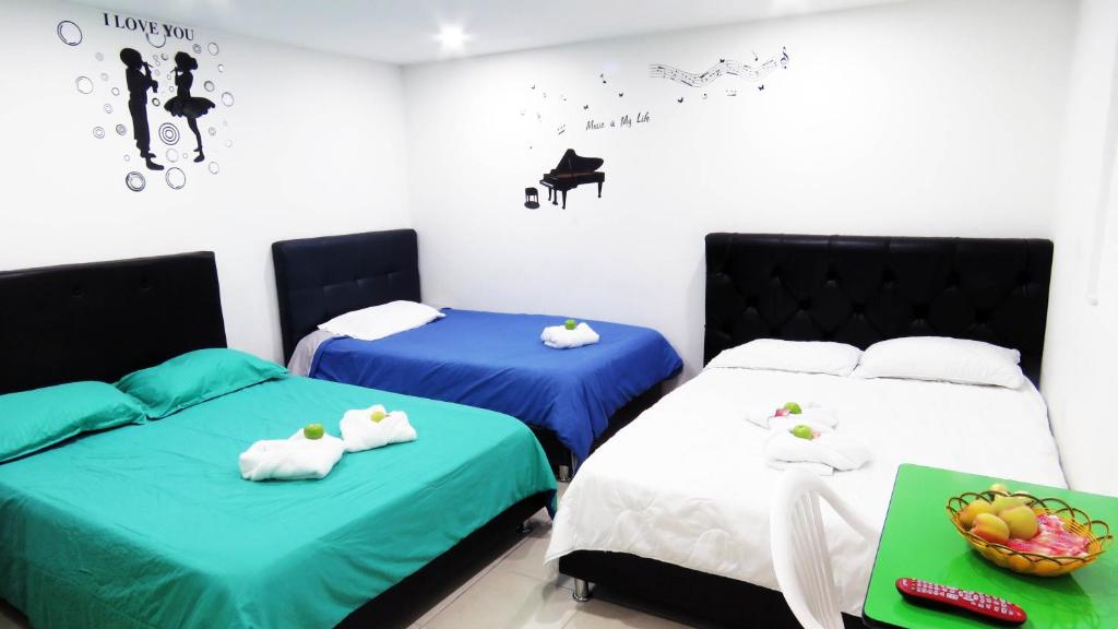 Postel nebo postele na pokoji v ubytování Hotel Bogota House
