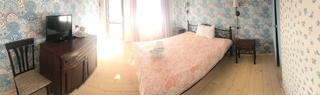 Postel nebo postele na pokoji v ubytování Minihotel Zolotoe Runo