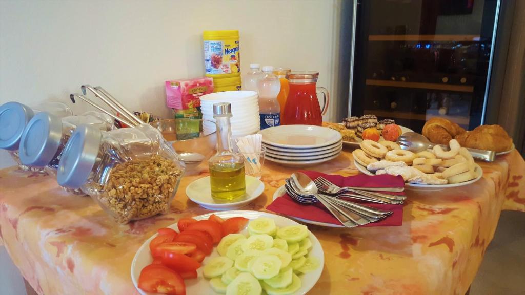a table with plates of food on top of it at Agriturismo Gradec in Aurisina
