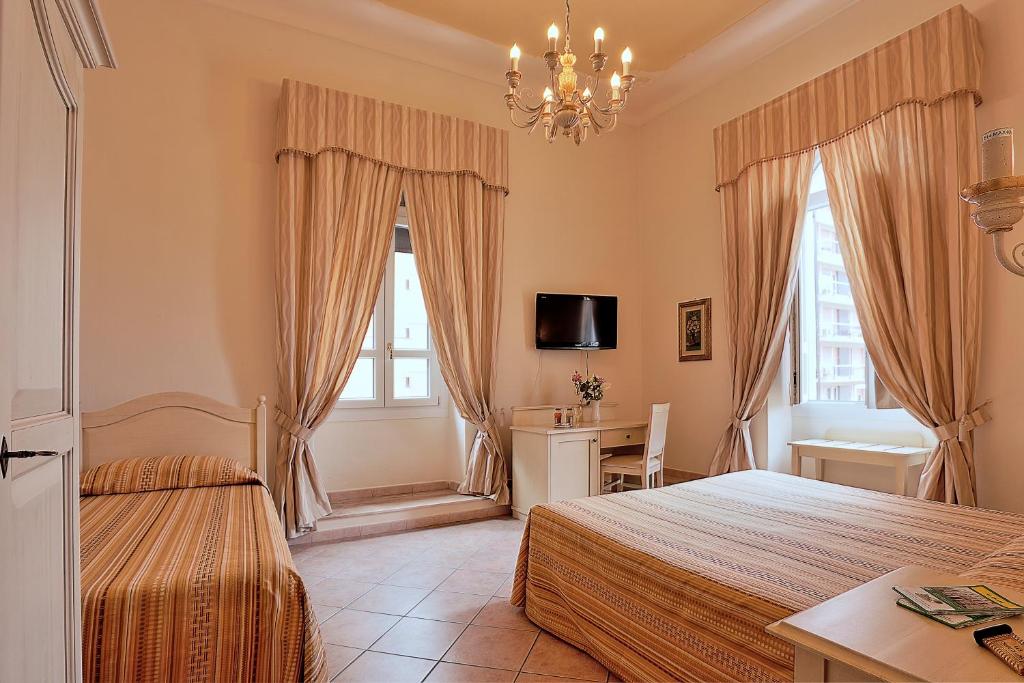 A bed or beds in a room at Chiaro Di Luna viale Italia