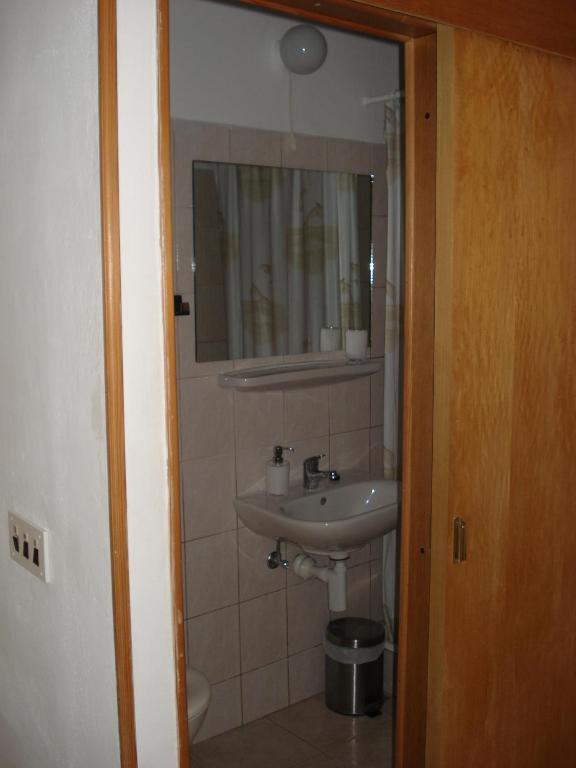 Koupelna v ubytování Apartments Luka