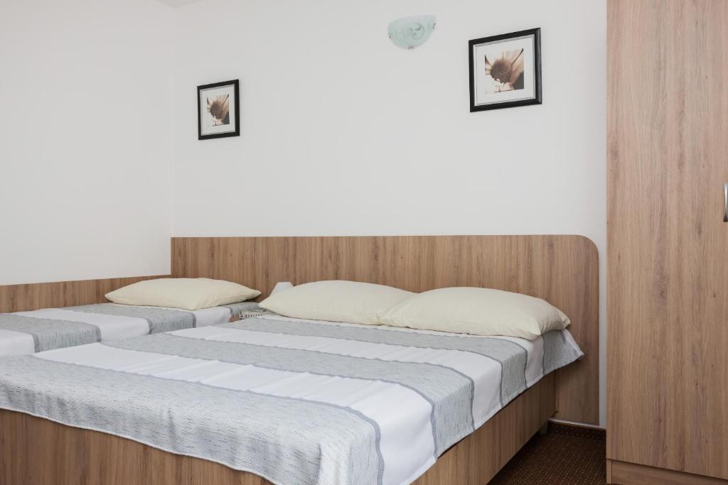 Postel nebo postele na pokoji v ubytování Dom Gościnny Oskar