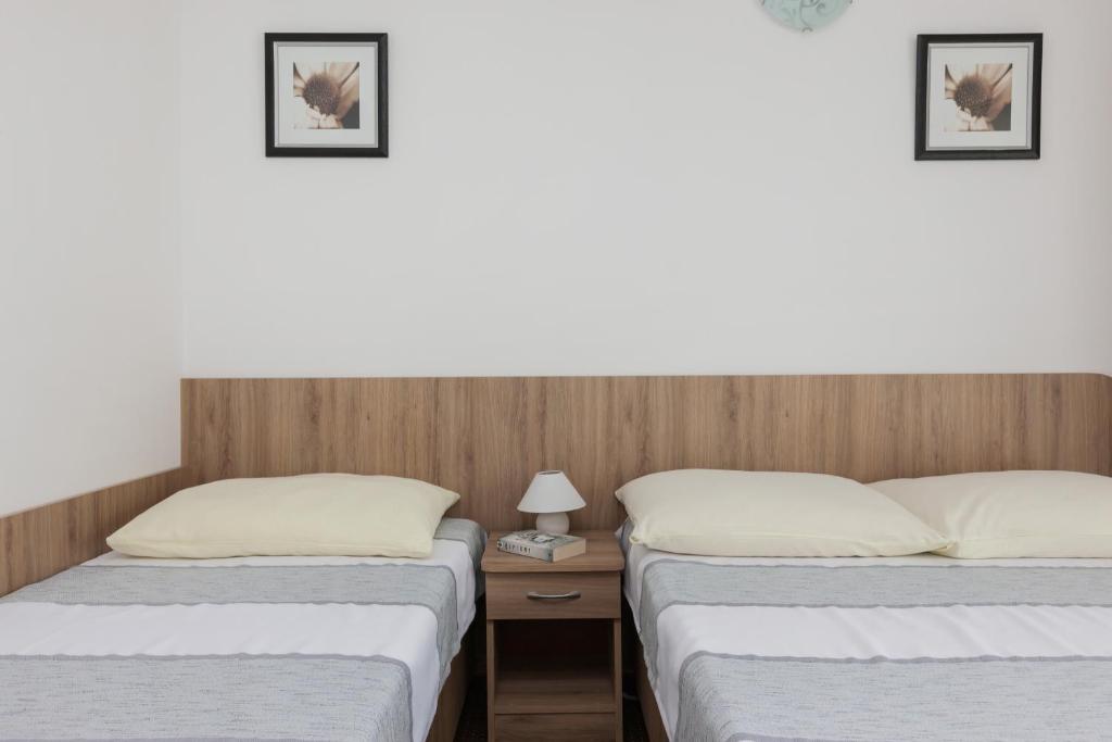 Postel nebo postele na pokoji v ubytování Dom Gościnny Oskar