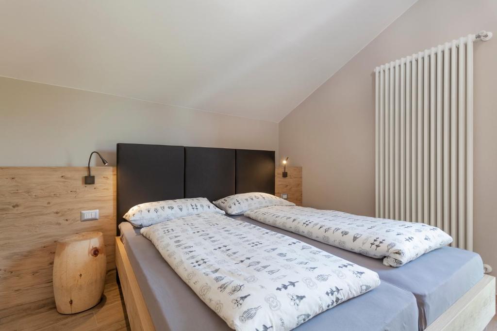 Postel nebo postele na pokoji v ubytování Residenza Al Cadin