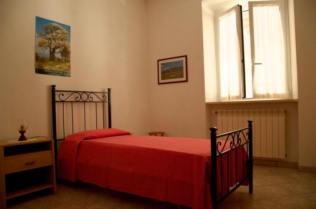 Łóżko lub łóżka w pokoju w obiekcie Agriturismo San Lino-Gilberto