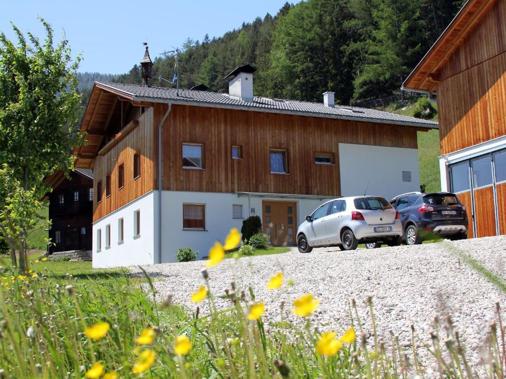 a car parked in front of a building at Huberhof in San Giovanni in Val Aurina