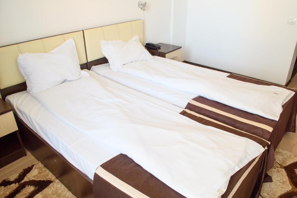 Postel nebo postele na pokoji v ubytování Hotel Clas