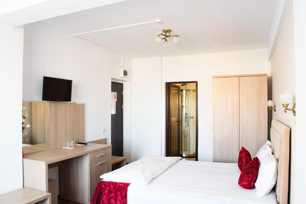 Un pat sau paturi într-o cameră la Hotel Clas