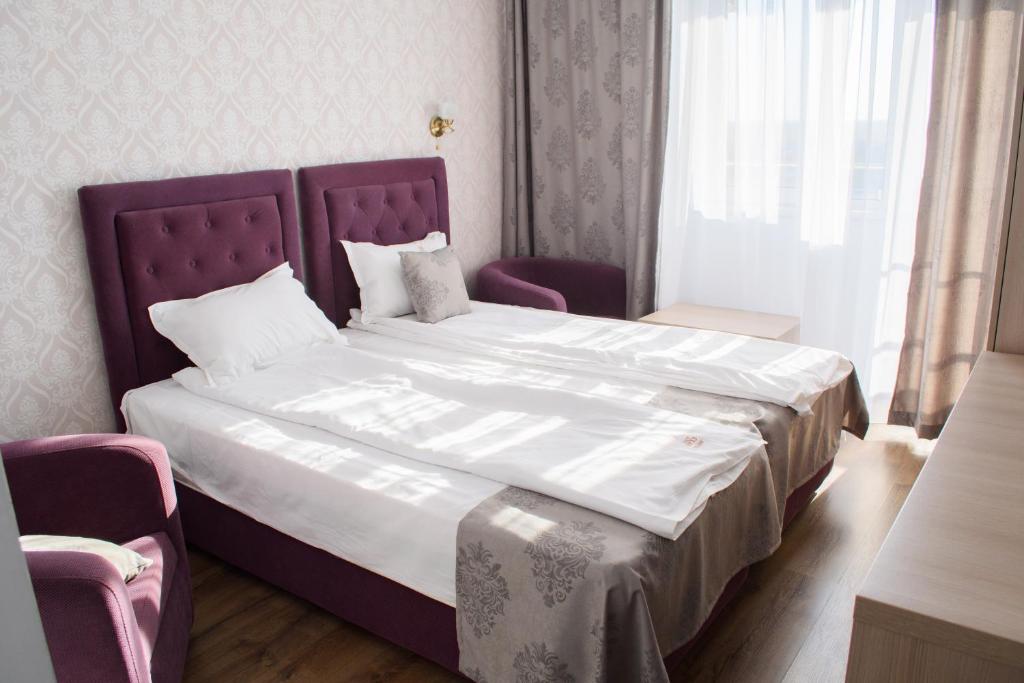 Postel nebo postele na pokoji v ubytování Hotel Clas