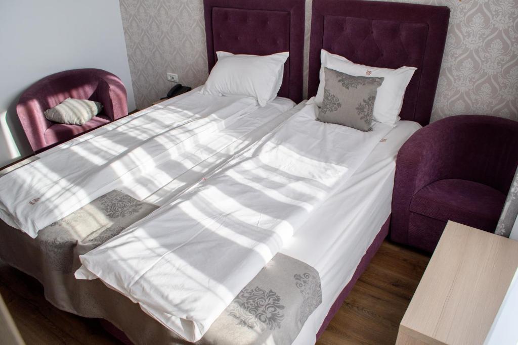 Postel nebo postele na pokoji v ubytování Hotel Clas