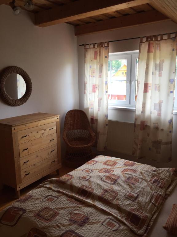 Postel nebo postele na pokoji v ubytování Apartments Huty