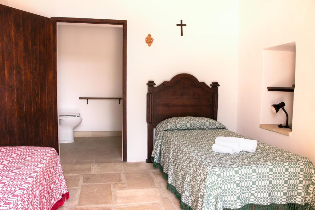 Postel nebo postele na pokoji v ubytování Terra di Leuca