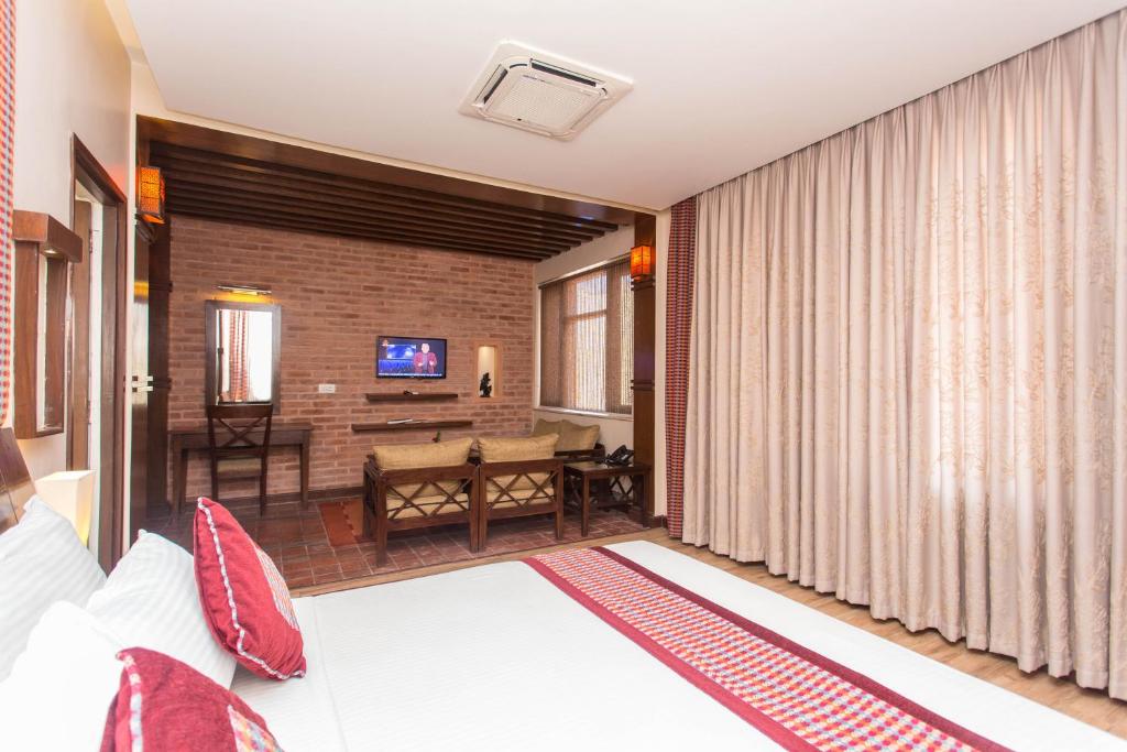 Postel nebo postele na pokoji v ubytování Hotel Marshyangdi