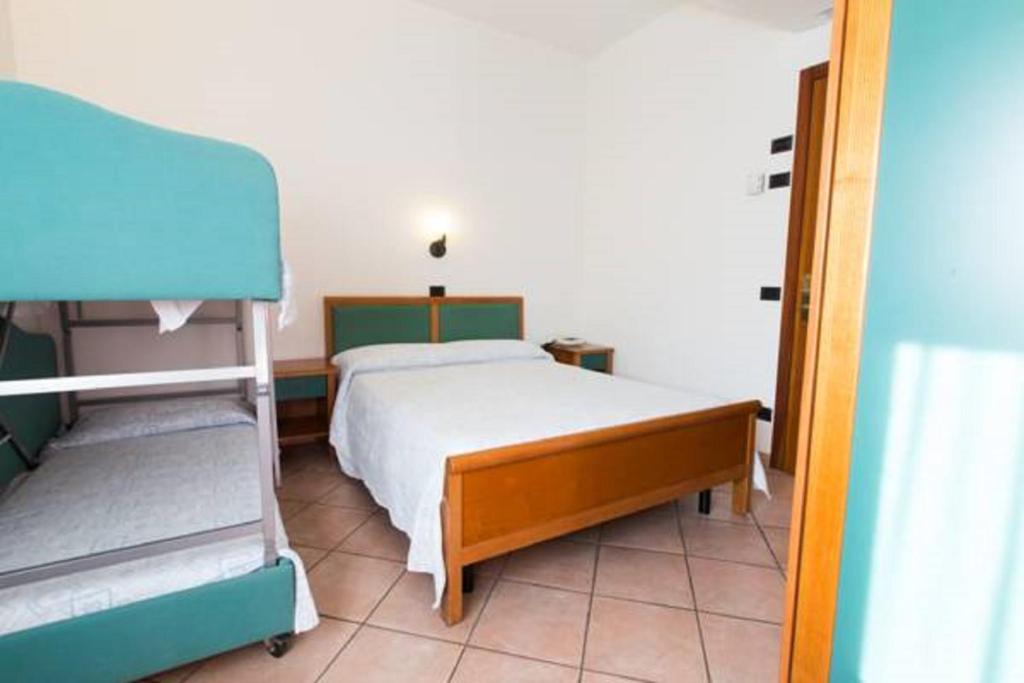 Postel nebo postele na pokoji v ubytování Albergo Cenni