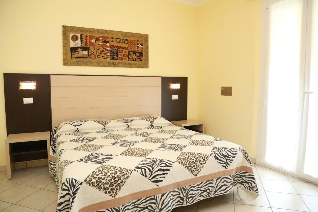 Postel nebo postele na pokoji v ubytování Hotel Ambra