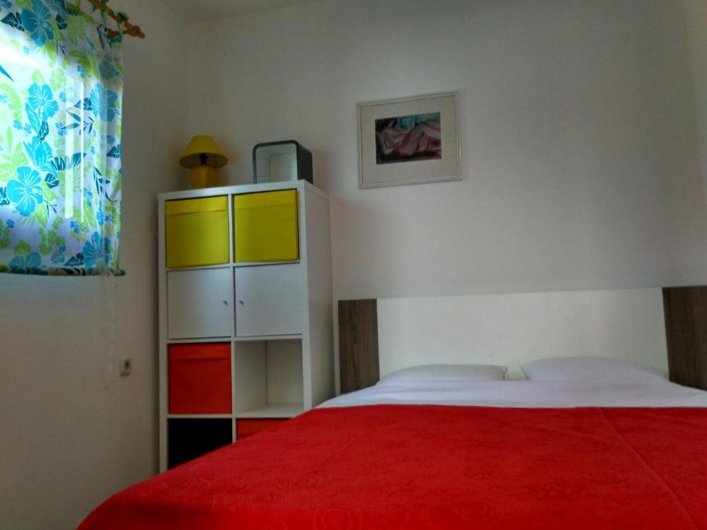 Postel nebo postele na pokoji v ubytování Apartments Ljerka