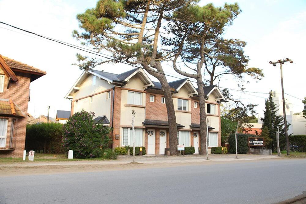 a large house on the side of a street at Complejo las Morochas in Valeria del Mar