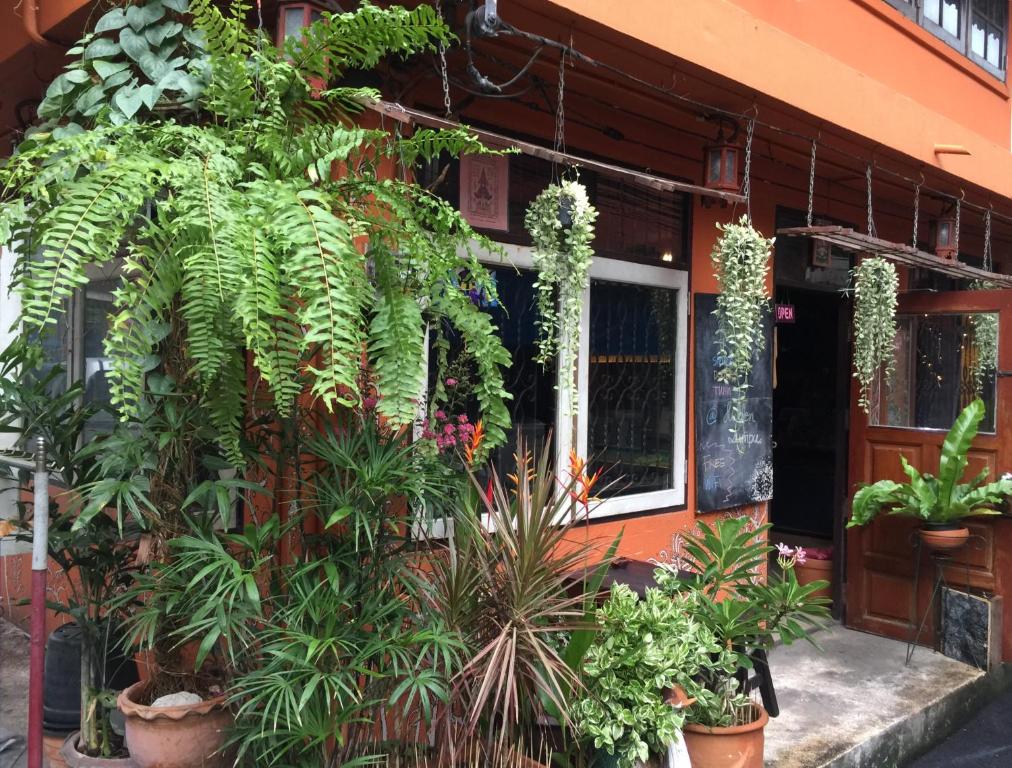 a building with plants on the side of it at Hidden Lumpu in Bangkok