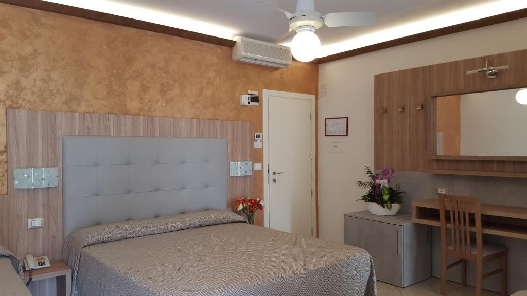 Postel nebo postele na pokoji v ubytování Hotel Ambra