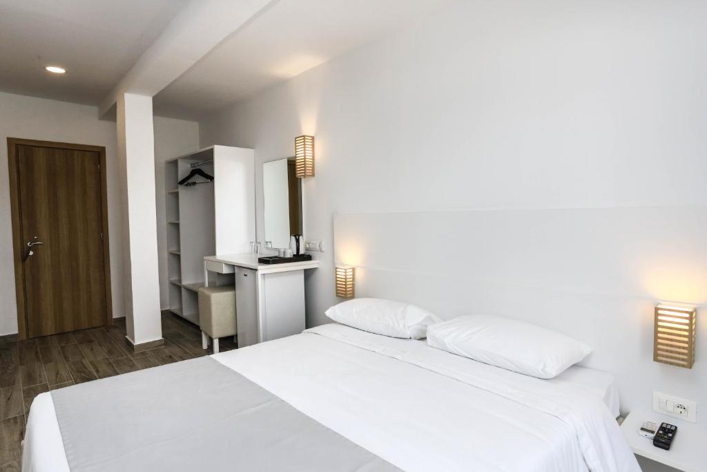 Postel nebo postele na pokoji v ubytování Blu Acqua Hotel