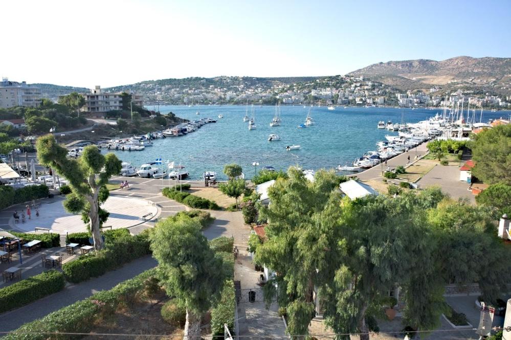 a view of a harbor with boats in the water at Nikolaki Rooms in Porto Rafti