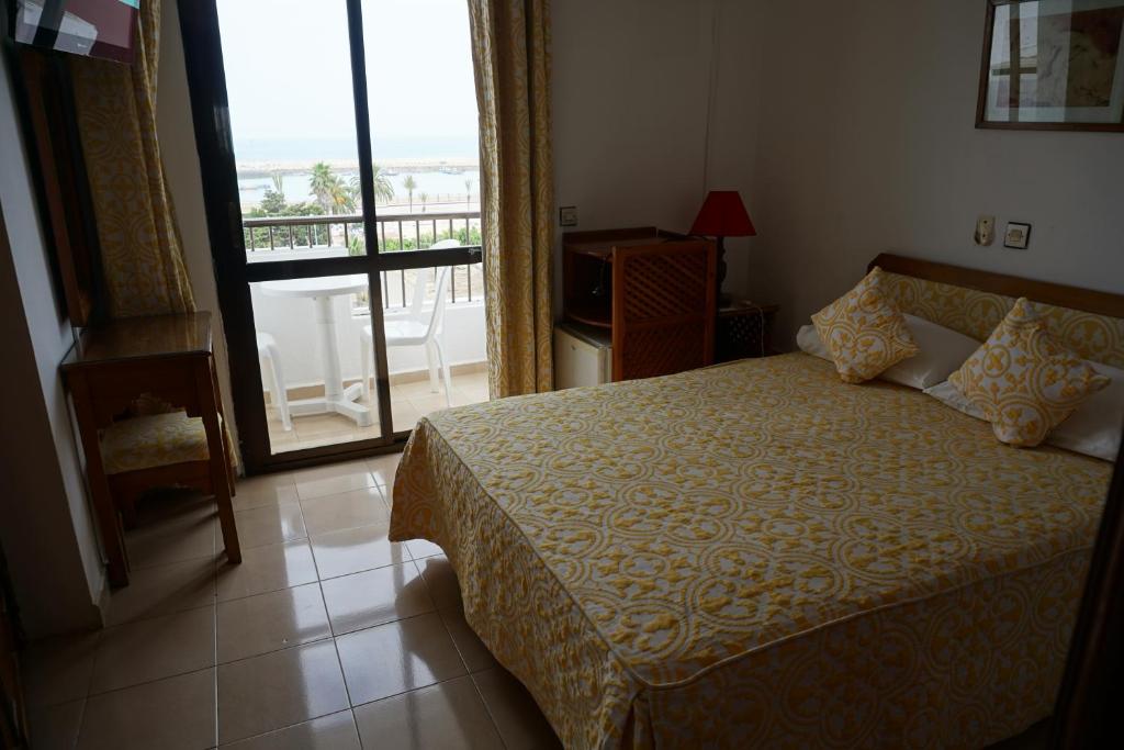 Postel nebo postele na pokoji v ubytování Hotel Zelis