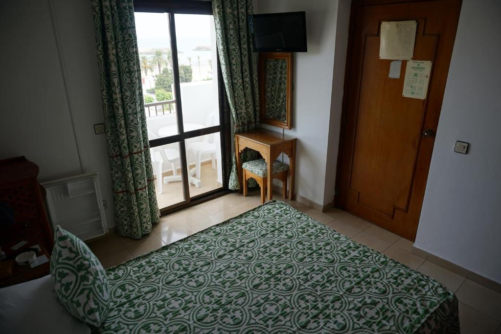 Postel nebo postele na pokoji v ubytování Hotel Zelis