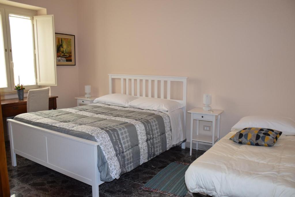 Postel nebo postele na pokoji v ubytování B&B Cumpari Turiddu
