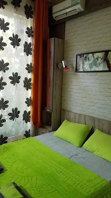 Postel nebo postele na pokoji v ubytování Nona's Guest House