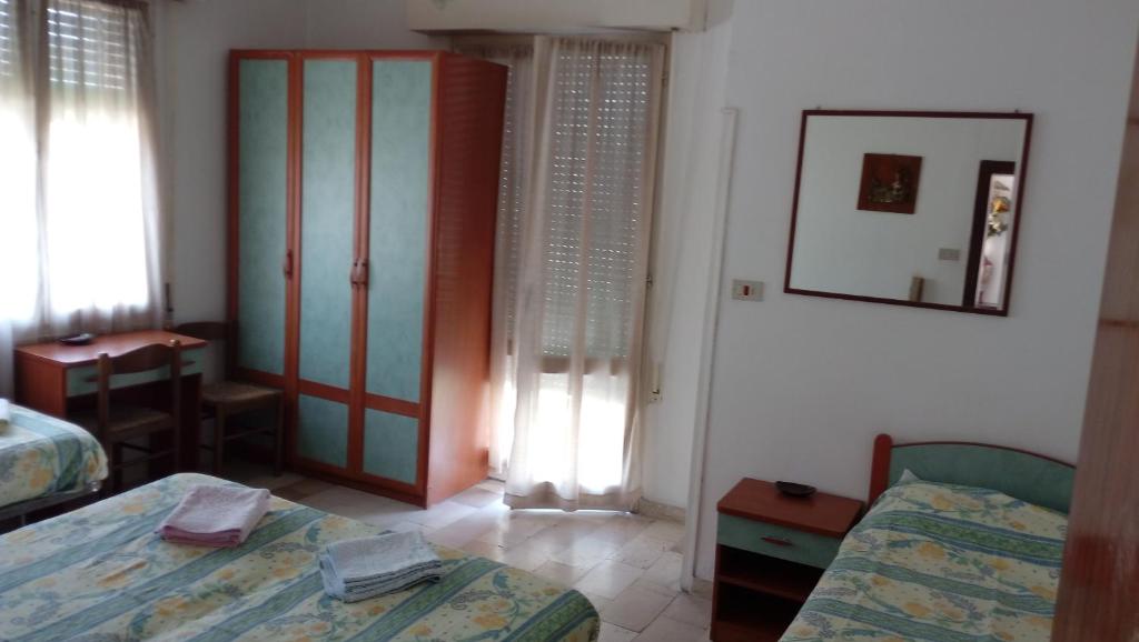 Postel nebo postele na pokoji v ubytování Hotel Taormina