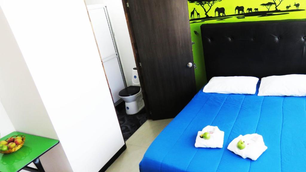 Postel nebo postele na pokoji v ubytování Hotel Bogota House