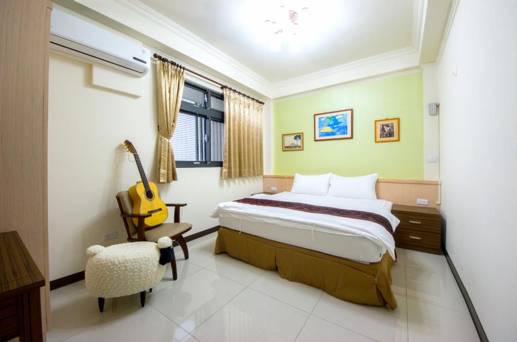 Postel nebo postele na pokoji v ubytování Guitar Charm B&B